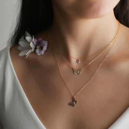 A woman wearing butterfly jewellery