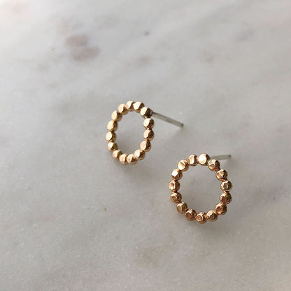 Small gold-fill circle earrings with a textured surface.